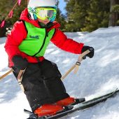 Sarah Schleper’s son Lasse skiing in a Kinderlift vest